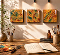 Three Gilded Tide 4×4 resin-coated wood panels displayed above an artist’s worktable