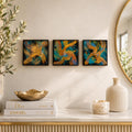 Three Midnight Current 4×4 abstract wood panels displayed in a row above a console